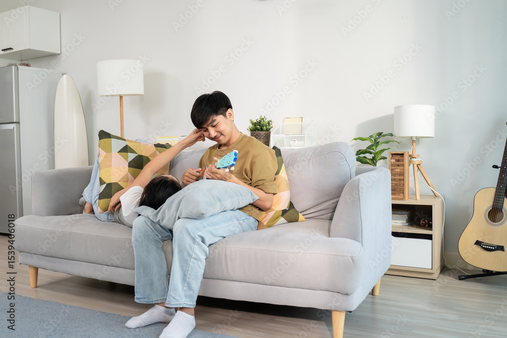 Fototapeta premium Asian young new marriage couple spend leisure time together in kitchen at home. 