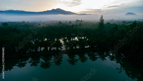 Early morning aerial view of mountains and fog.