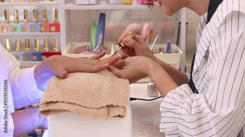 Asian senior woman happy to show beautiful fingers joyful beautify in nail and spa shop with worker female or beauty small business entrepreneur, elderly pensioner with silver hair fashion lifestyle