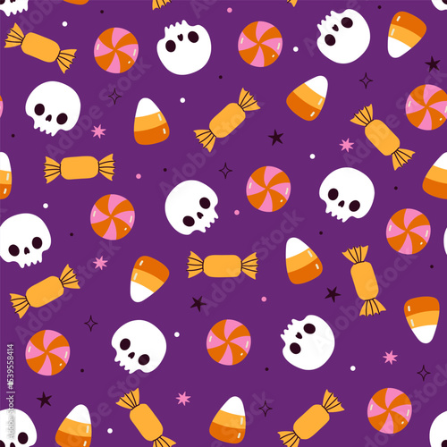 Seamless halloween pattern with candies and skulls on purple background. Vector graphics.