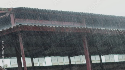 A heavy rain or raindrop falling hit on the market structure roof, weather forecast and rain season, 4K high quality video footage