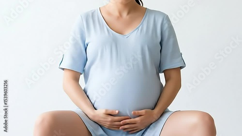 pregnant woman touching her belly