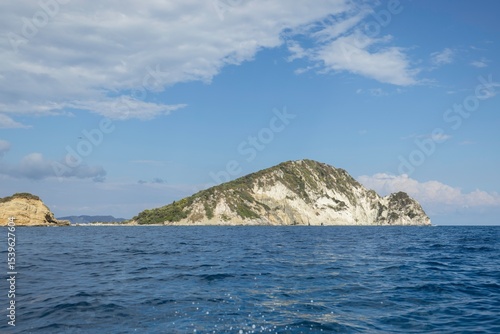 Wallpaper Mural Sailing towards secluded islands, a group of adventurous travelers enjoys the serene ocean breeze and stunning views under a bright summer sky. Perfect for nature lovers and explorers Torontodigital.ca
