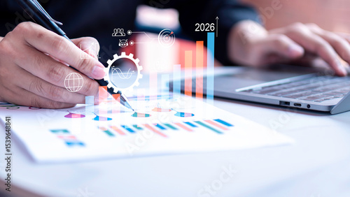 Concept 2026 of strategic planning and data-driven growth forecasting, professional analyzing charts with digital graphical analytics interface.