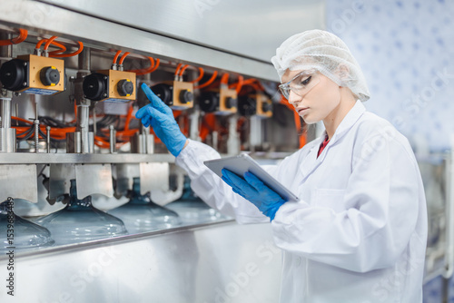 Fotografija Machine technician service maintenance drinking water filling machine in drink f