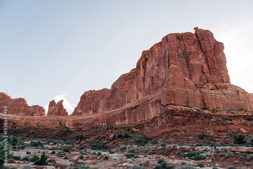 Fototapeta premium Layered red rock cliffs with visible strata in Arches, Utah
