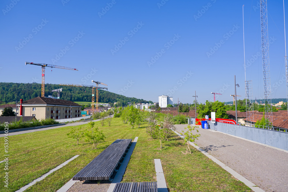 Naklejka premium Opening day of public park named Ueberlandpark at Swiss city of Zürich on a sunny spring morning. Photo taken May 10th, 2025, Zurich Schwamendigen, Switzerland.