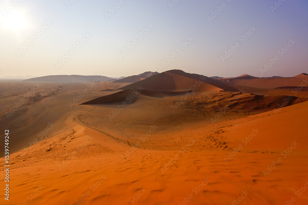 Naklejka premium View from red sand dune 45 on the surrounding dunes and plains, Sossusvlei , Namib-Naukluft, Namibia