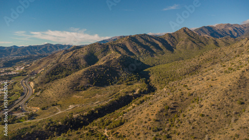 Rugged Hills and Winding Road Near Nerja, Captured by Drone