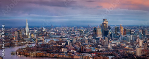 Photography Wide panorama of the urban London city skyline during a colorful sunrise, United