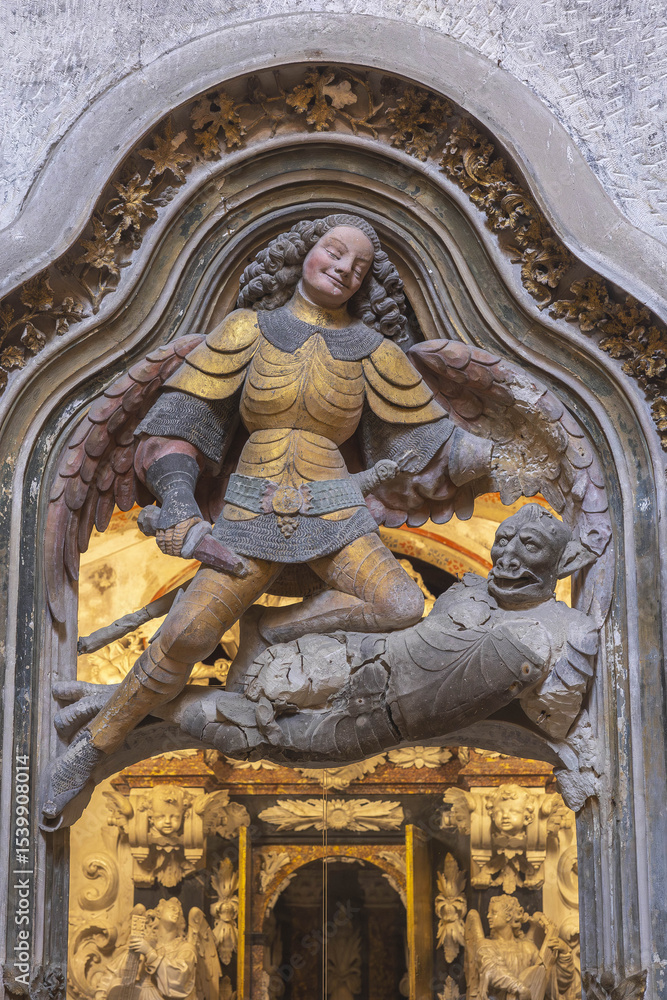 Fototapeta premium Saint Thecla’s cathedral, Tarragona, Spain. Apse sculpture : Saint Michael and the dragon