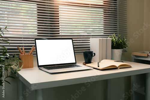 Wallpaper Mural Modern home office workspace with a blank laptop screen, open notebook, and coffee mug Torontodigital.ca