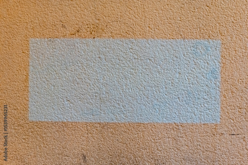 Fototapeta premium Unsung textures reveal hidden stories on a weathered wall in a quiet urban setting, offering a glimpse into the passage of time and change