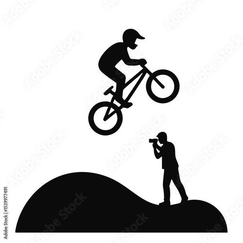 BMX rider performing an airborne trick while being photographed  