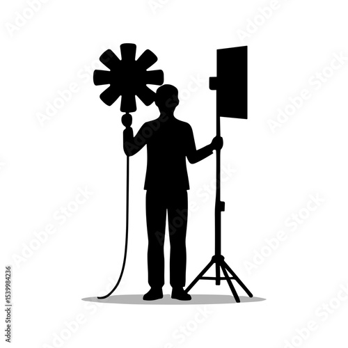 Silhouette of portrait photographer holding reflector and light stand for Photographer's Day  