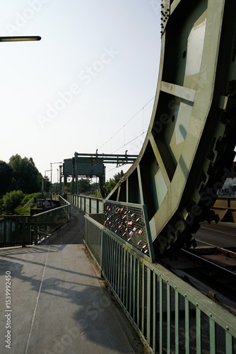 Close-up of an industrial bridge in sunlight with clean lines and shadows. The bascule bridge for trains over the Hunte River in 26122 Oldenburg