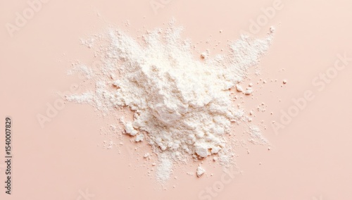 Pile of white flour on a pale pink surface