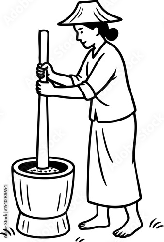 Asian farmer pounding rice grains in a tradional mortar