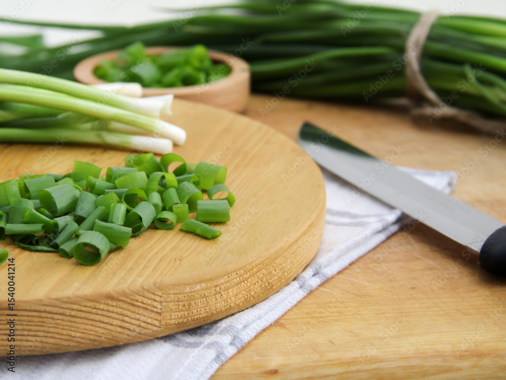 Chopped greens with knife on cutting board Chopped greens with knife on cutting board