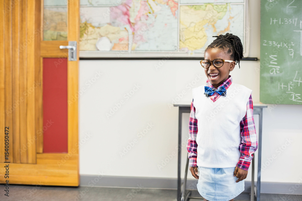 Fototapeta premium Wooden door with red panel featuring world map on classroom wall, chalkboard showing equations