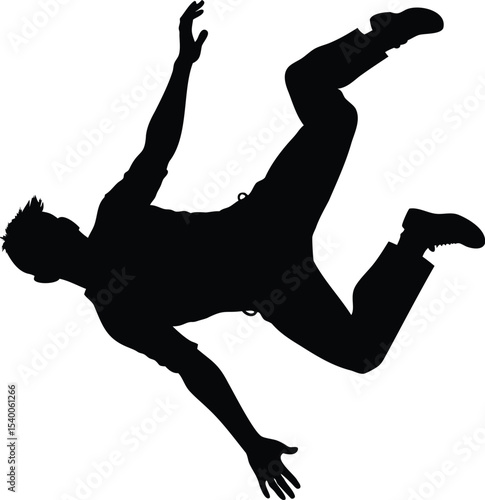 Silhouette of a man falling down or dancing with arms outstretched gracefully
