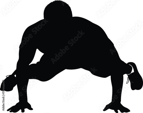 Silhouette of a man performing advanced yoga or calisthenics position