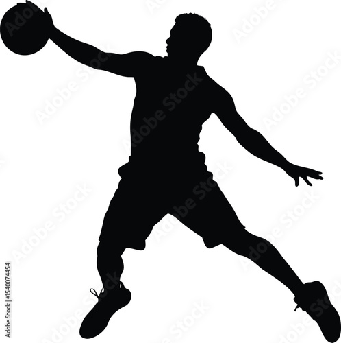 Silhouette of a basketball player in mid air about to shoot