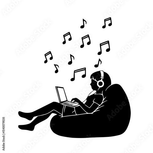 Young woman relaxed, enjoying music while using a laptop, on a bean bag chair with copy space