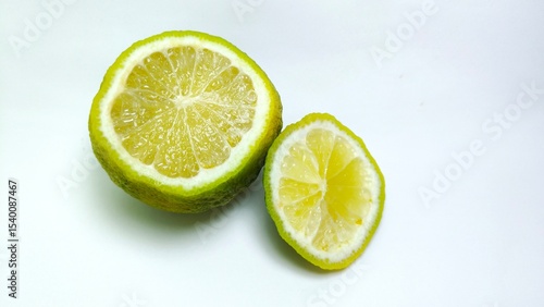 Fresh lime cut in half on white background, good for health. herbal food