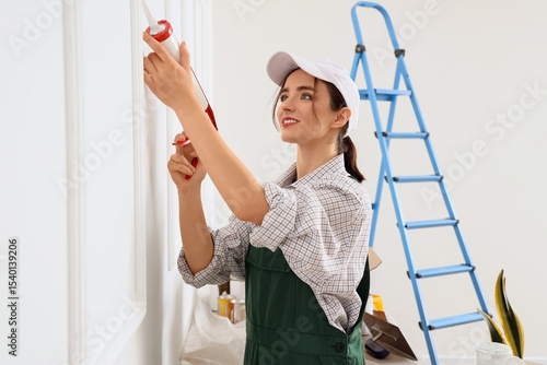 Female worker applying seal...