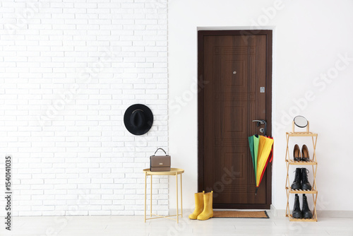 Modern home entryway with d...