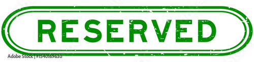 Grunge green reserved word rubber seal stamp on white background