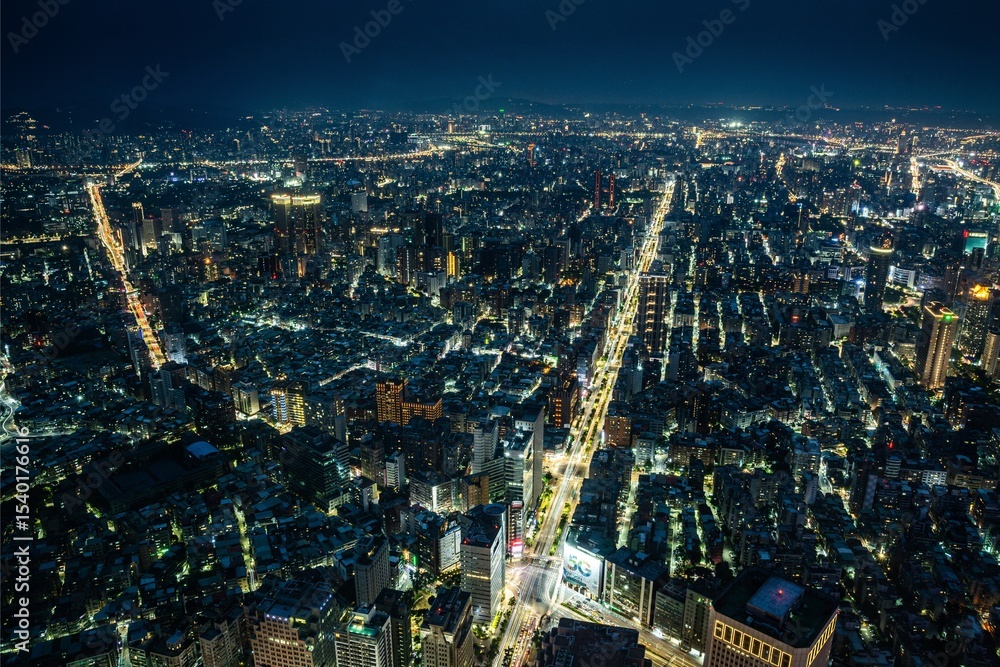 Obraz premium New York City's urban skyline at night, an aerial view of Manhattan's illuminated cityscape and towering skyscrapers