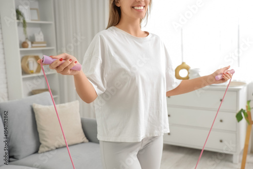 Sporty young woman with ski...