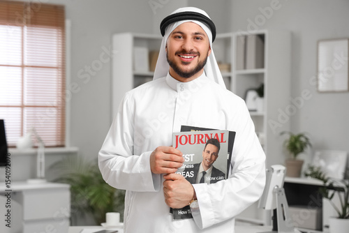 Arab businessman with magaz...