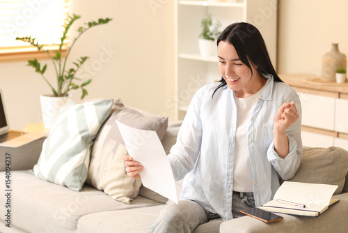 Young woman with refund for...
