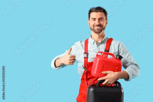 Male mechanic with canister...