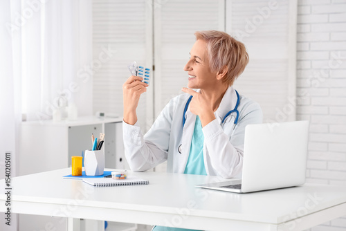 Happy mature female doctor ...