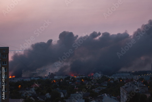 Black smoke from explosion in Kyiv, Ukraine. Russian invasion to Ukraine. Missile attack in Kyiv. Kyiv cityscape in fire, view from window. War in Ukraine. Russian aggression in Ukraine. 