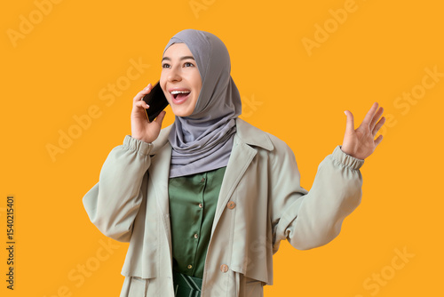 Happy young Muslim woman in...