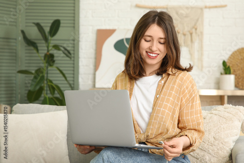 Young woman unplugging char...