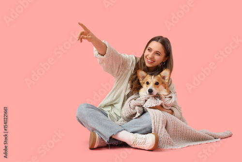 Young woman with Corgi dog ...