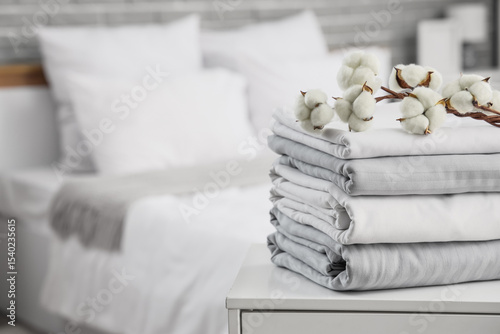 Stack of clean bed sheets w...