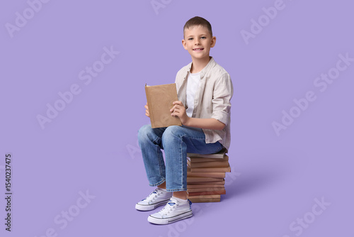 Cute little boy sitting on ...