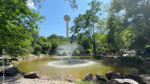Ankara, Turkey - June 15, 2025: Botanical Garden and Atakule in background in the spring, 