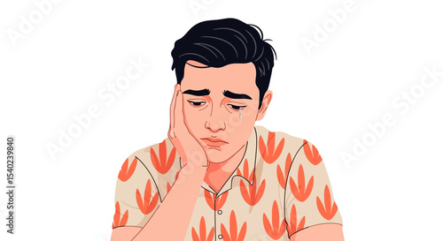 Depressed man with tear, hand on face, wearing patterned shirt
