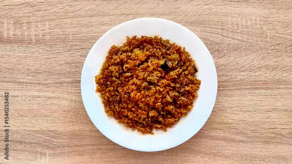 This jollof rice is cooked with spices, colorful vegetables, and flavors for ultimate enjoyment in your meals This jollof rice is cooked with spices, colorful vegetables, and flavors for ultimate enjoyment in your meals