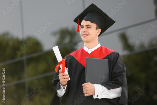 Male graduating student wit...