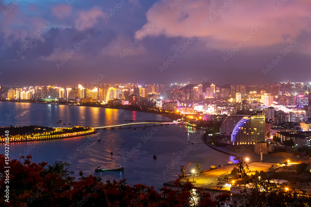Naklejka premium The night view of Sanya Bay in Sanya City, Hainan Province, China