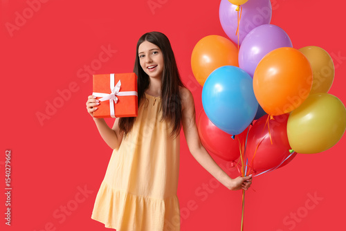 Happy teen girl holding bir...